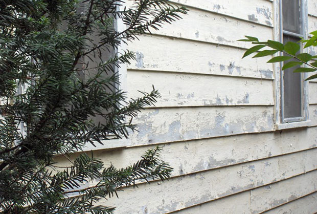 peeling right side of house